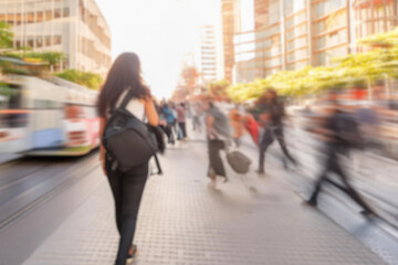 blurred for background. Crowd of people on the street. people walking on the city street. A blurry people walking. Urban, social concept. Abstract urban background with blurred buildings and street.