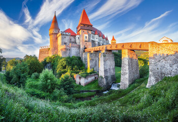 Amazing panoramic morning view of Hunyad Castle / Corvin's Castle with wooden bridge.