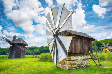 Amazing summer view of traditional romanian windmill.