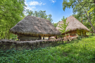 Gorgeous summer scene of traditional romanian peasant houses.