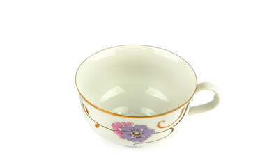 Empty vintage porcelain tea cup isolated on white