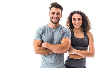 Young smiling man and woman in athletic wear standing