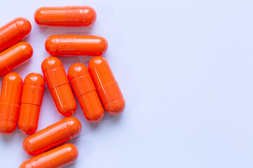 Close-up of orange pill capsules isolated on white background,Organic turmeric capsules isolated on white background