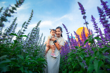 Mother and child in the flower field,mother and little daughter in a flowering lavender field...
