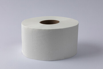 Toilet paper roll on grey white background.