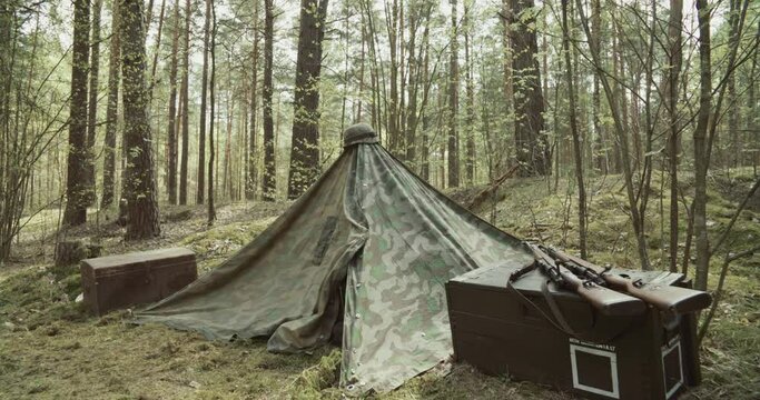 Wermacht German Military Field Tent. Concept Of Military Rest Stop. Rifles Lie On Ammunition. Carabines Mauser 98k During Ww2. Old Vintage German Infantry Army Helmet. Reenactment Tactic Game. Autumn.