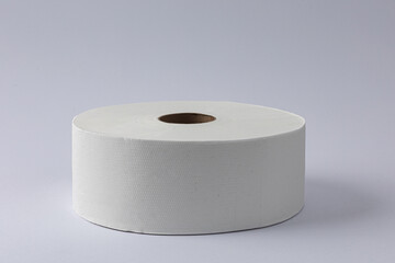 Toilet paper roll on grey white background.