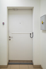 a white metal door to the safe room, a view from the interior of the room. storage of valuables