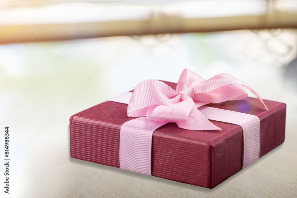 Wall mural Beautiful gift box with soft tender ribbon