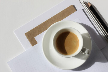 Espresso Coffee on Stacked Papers on Office Desk. Business Workplace Mockup. 