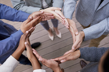 Hands, businesspeople and circle symbol for synergy or teamwork with huddle for team in outdoors....