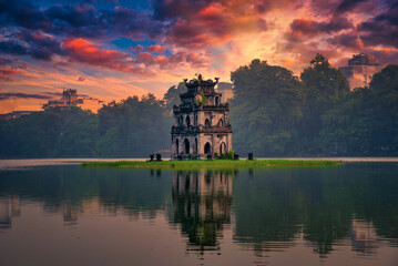 Turtle Tower on Hoan Kiem Lake at sunset in Hanoi, Vietnam. Vintage tone