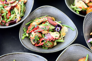 A close-up image of a delicious and healthy seafood salad with vegetables.