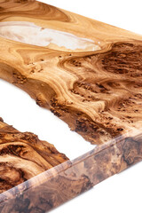 Live edge elm burl slab table top with central epoxy resin river on white background, combining...