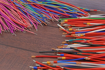 Copper electrical wiring wires in colored insulation for connecting electrical equipment. Close-up....