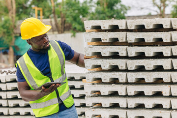 African black engineer worker working in Precast concrete casting manufacturing checking product...