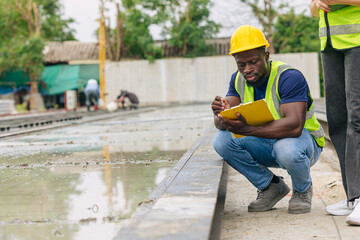 African black engineer worker working in Precast concrete casting manufacturing checking product...
