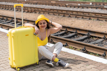 Ease of travel: a young tourist is preparing for new adventures. Tourist atmosphere: a young girl...