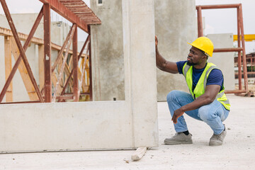 African black engineer worker working in Precast concrete casting manufacturing checking product quality standard outdoor construction site