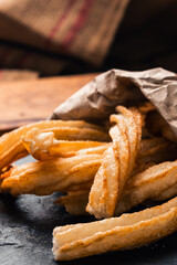 close-up of hot crocane flour churros fried in oil