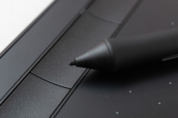 Top view of graphic tablet and pen for illustrators, designers and photographers on light background. 3d