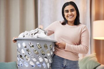 Laundry, basket and portrait of woman in home and happy spring cleaning, task or activity. Maid,...