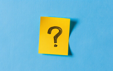 Yellow Question Marks on blue pastel background
