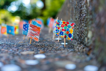 Fototapeta premium Children's hand-painted flags in a row for a Memorial Day display, artistic shot.