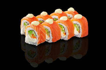 Salmon sushi rolls with avocado, tobiko and cream cheese on black