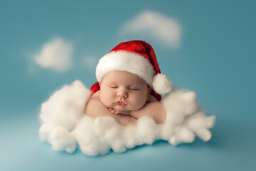 Newborn baby wearing santa claus outfit, sleeping on a fluffy white cloud on a blue background