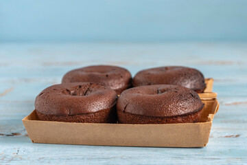 Double Chocolate Muffins on wooden background.	
