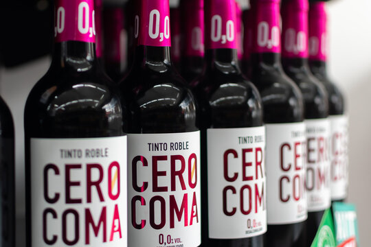Bottles of Spain wine Cero Coma Tinto Roble Desalcoholizado close-up on wine shelf. Ukraine, Zhytomyr, May, 13, 2024