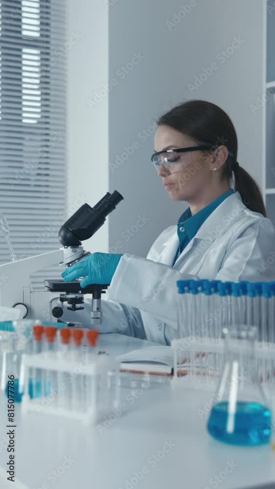 Poster in the laboratory, the molecular biologist studies the genetic mechanisms of oncogenesis to develop 