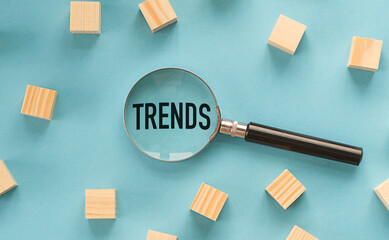 The image features magnifier glasses with the text Trends, emphasizing the main trend of change. It...