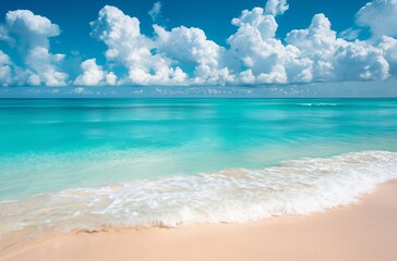Fototapeta premium Panoramic view of a sandy beach with clear turquoise water and a blue sky with clouds. Summer vacation and travel concept. Design for poster, advertisement, banner with copy space.