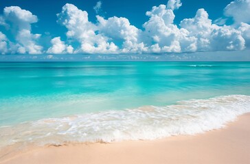 Panoramic view of a sandy beach with clear turquoise water and a blue sky with clouds. Summer vacation and travel concept. Design for poster, advertisement, banner with copy space.
