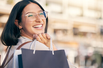 Excited, girl and portrait of shopping in city with discount sale, promotion or boutique in Italy. Customer, woman and smile with bags from store purchase of retail deal, clothes or fashion in Milan