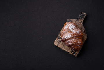 Delicious fresh sweet crispy croissant with chocolate