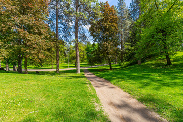 Trees, grass and walking paths at the central park area of the 90 acre Manito Park and Botanical Gardens in the South Hill district near downtown Spokane, Washington.