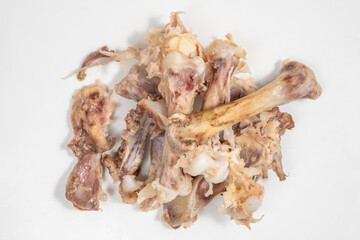 Food scraps. Chicken bones on white background.	