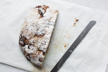 Overhead view of date jam filled sourdough bread, flatlay of date filled bread on a parchment lined baking sheet