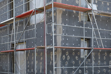 modern thermal insulation materials. building New House in process insulation of the wall of the...