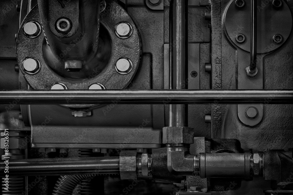 Poster a close up of a machine with many bolts and nuts. concept of complexity and intricacy, as well as th