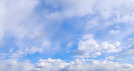 The sky is blue and clear with no clouds. The sun is shining brightly