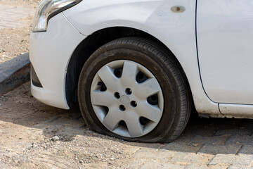 Close-up damaged car tire, Flat tire.