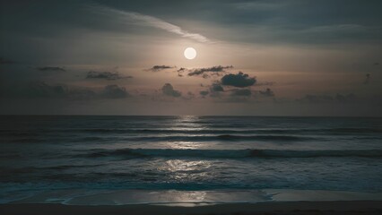 a full moon over the sea