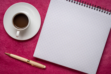 blank spiral notebook with ruled paper, flat lay with coffee on textured art paper