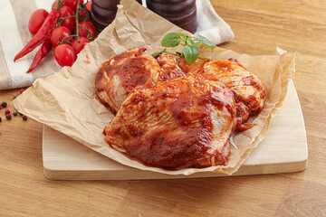 Marinated chicken leg in tomato sauce