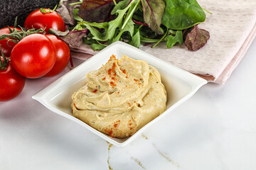 Creamy hummus in the bowl