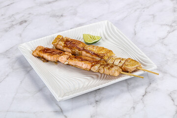 Grilled salmon skewer with sauce